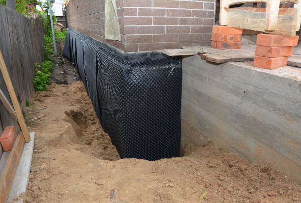 Happy homeowners after waterproofing job in Arcola